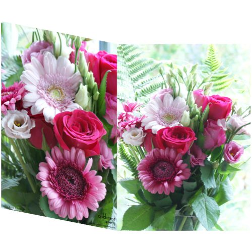 Two sides of a folded greeting card showing two views of a gerbera daisy and roses bouquet