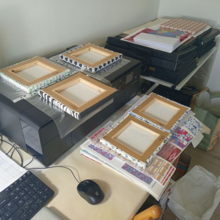 Photo of canvases and printer showing how to enjoy working from home